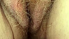 Redheaded MILF with saggy tits masturbates on toilet